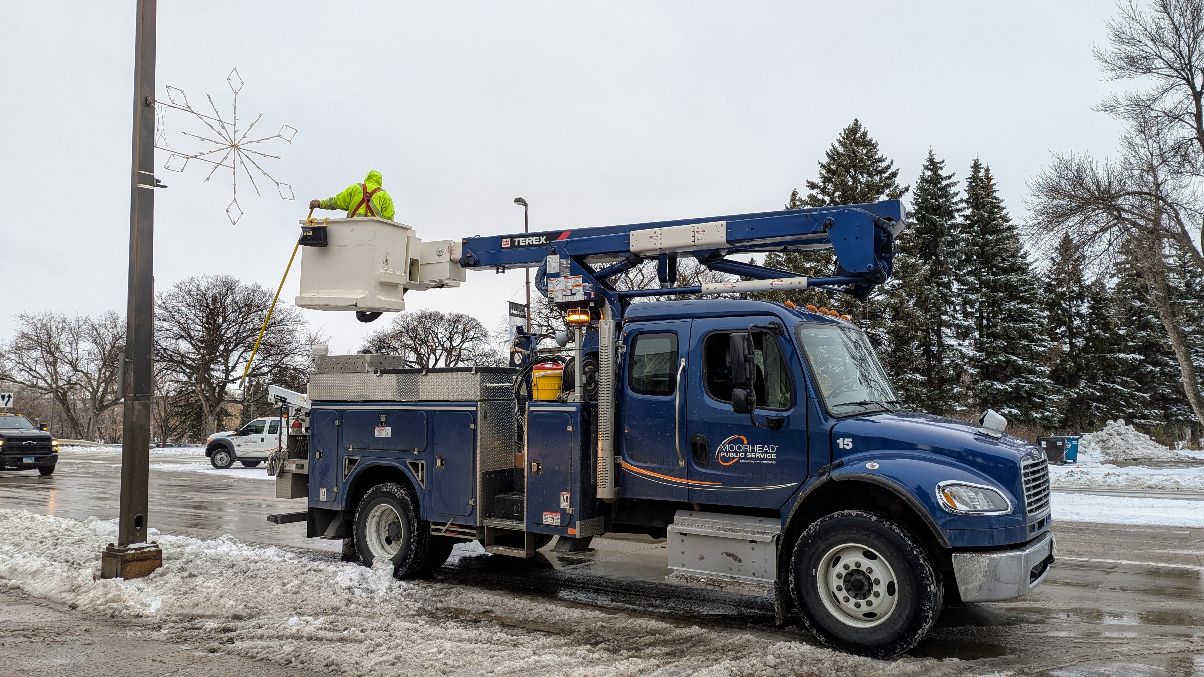 A blue mps truck stopped on the side of the road