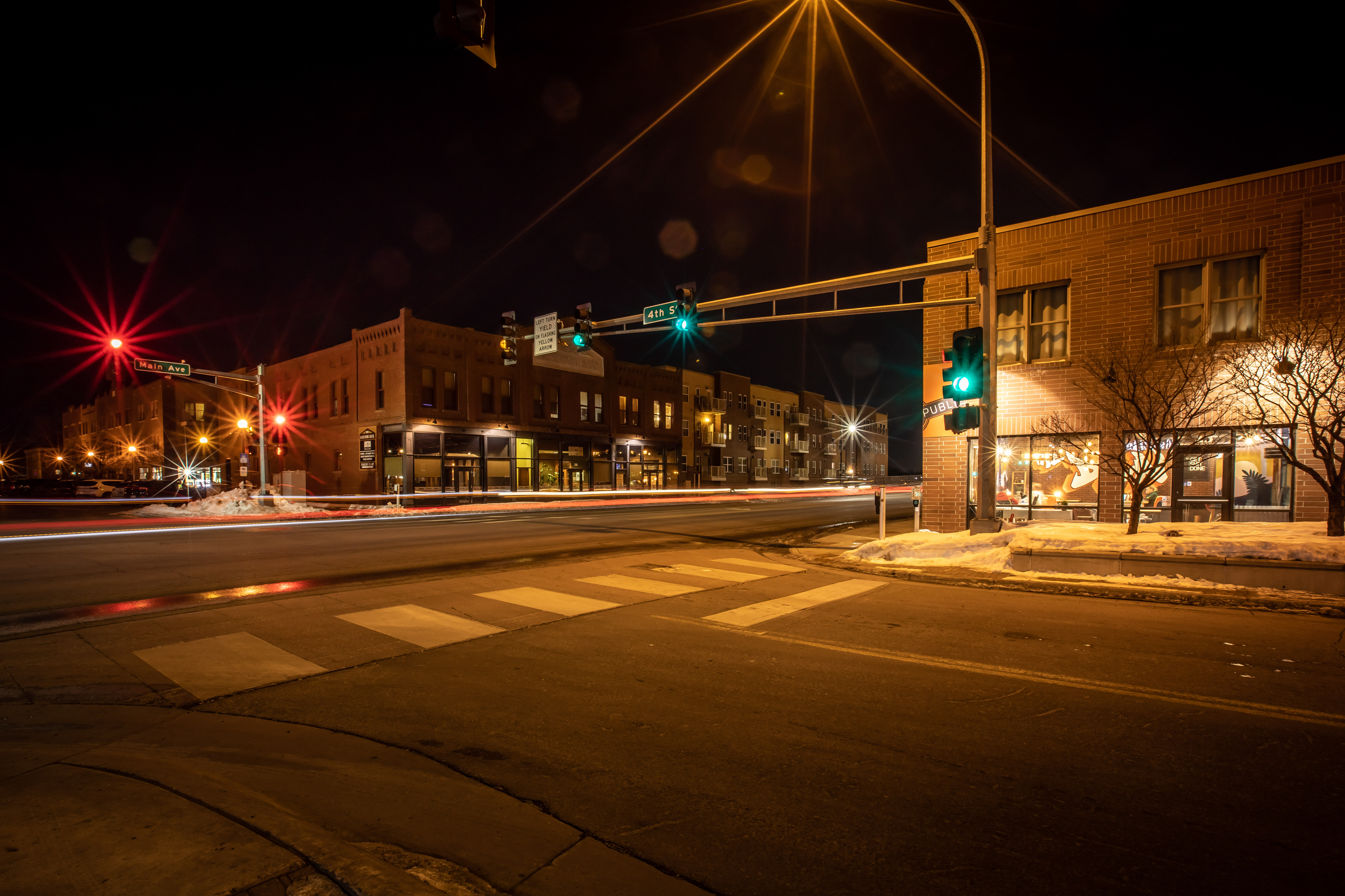 A streetlight shows green at night