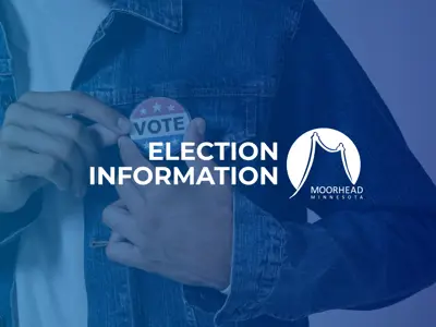 A photo of a person wearing a vote button with a blue hue with the text Election Information and a white City of Moorhead logo