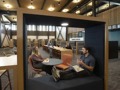 People reading and working in the Spark Center space