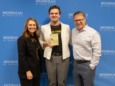 A photo of Austin winning the Moorheart with Mayor Carlson