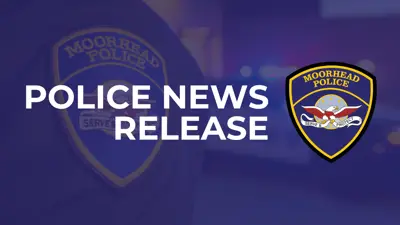blue hued image of a police officer's badge with lights from the squad car flashing and the words Police News Release with the Moorhead Police Department logo
