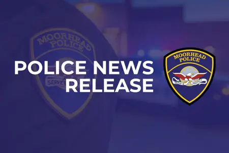 blue hued image of a police officer's badge with lights from the squad car flashing and the words Police News Release with the Moorhead Police Department logo