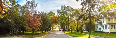 A street in Moorhead with cars parked in the distance