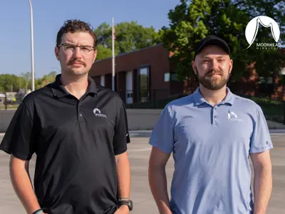 Blake and DJ stand outside the Fire Station
