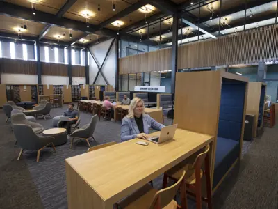People reading and working in the Spark Center space