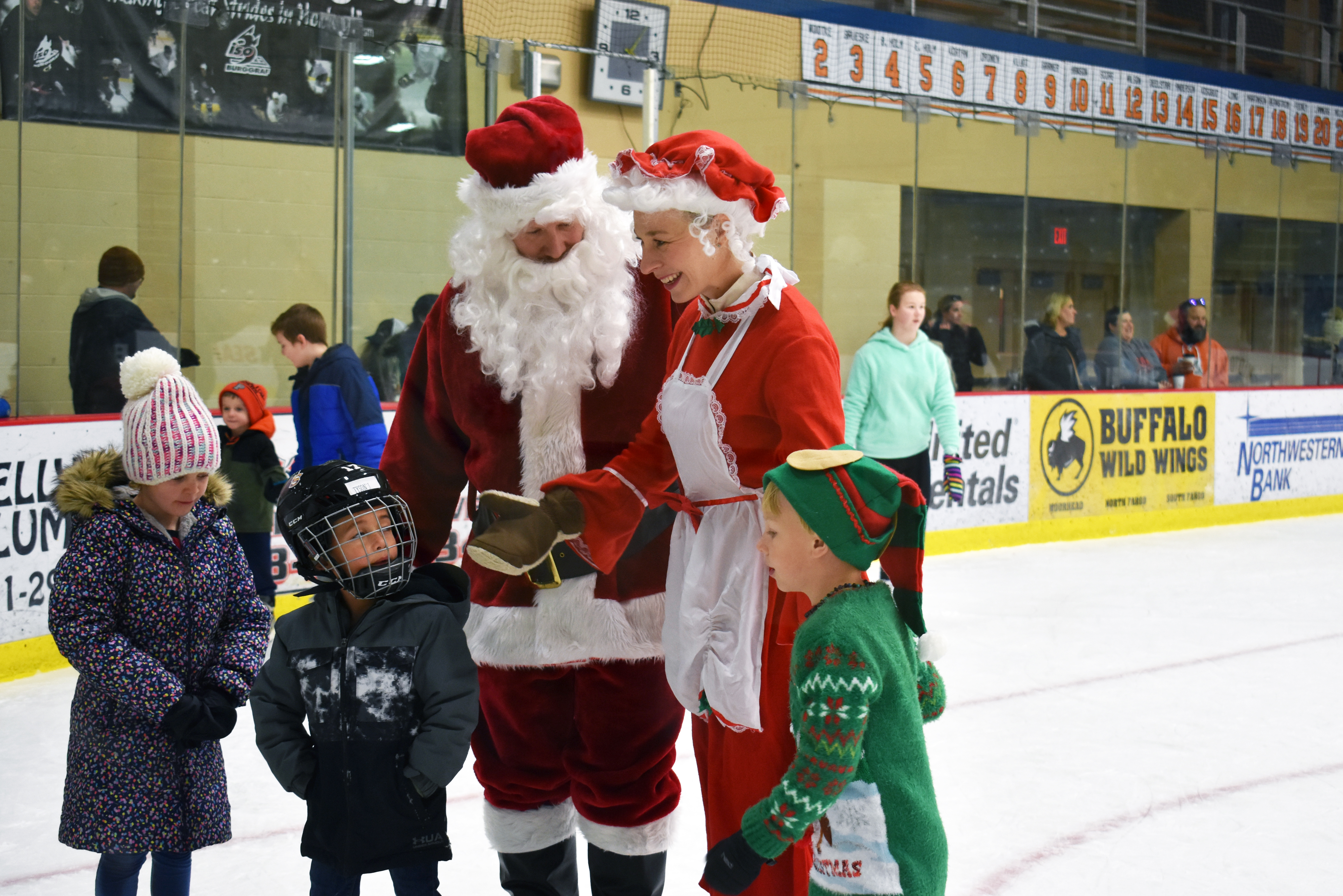 Kids skate with santa and mrs Claus